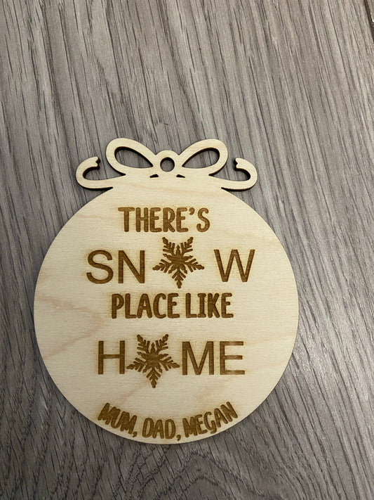 Wooden personalised “there’s snow place like home “ bauble - Laser LLama Designs Ltd